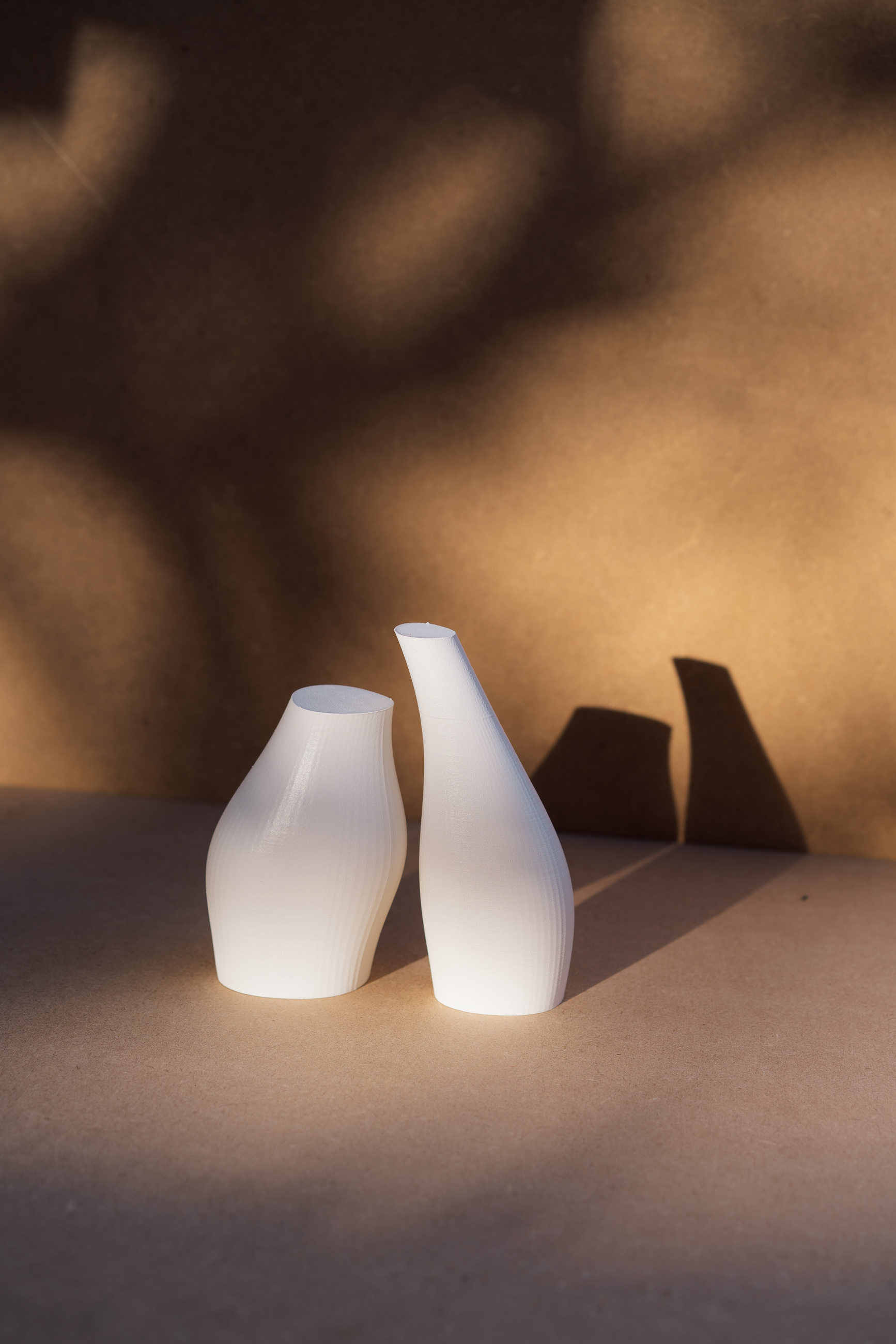 Near Contact - two white vessel forms with gap between