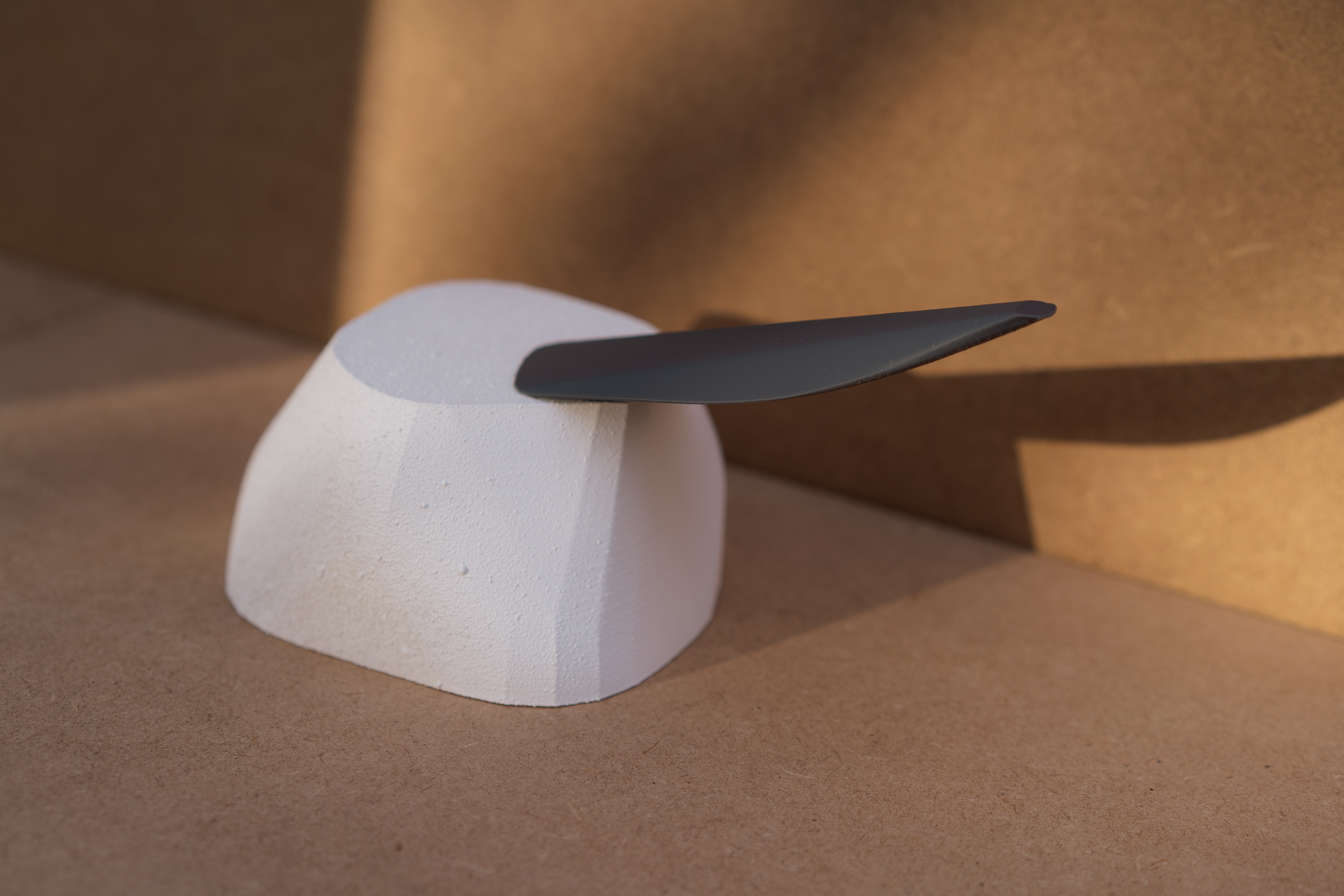 Reach - white anchor form with grey cantilever arm